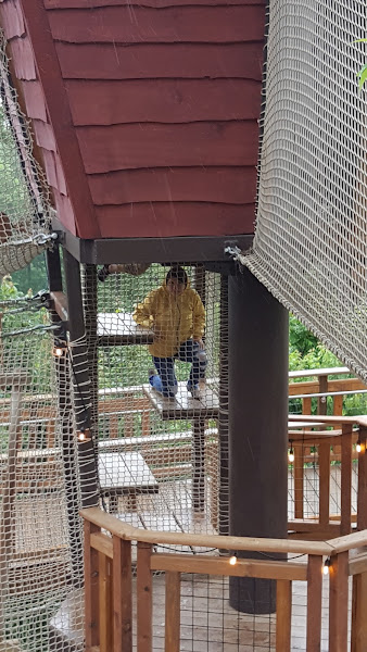 Climbing the structures at the children's playhouse