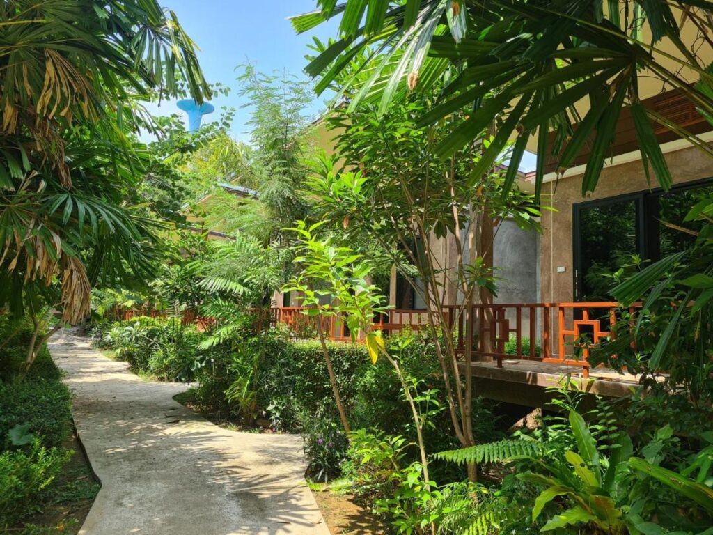 picture of bungalows surrounded by tropical flora