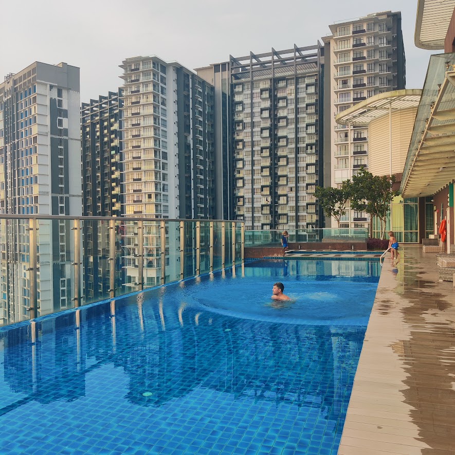 picture of a man swimming in a rooftop pool