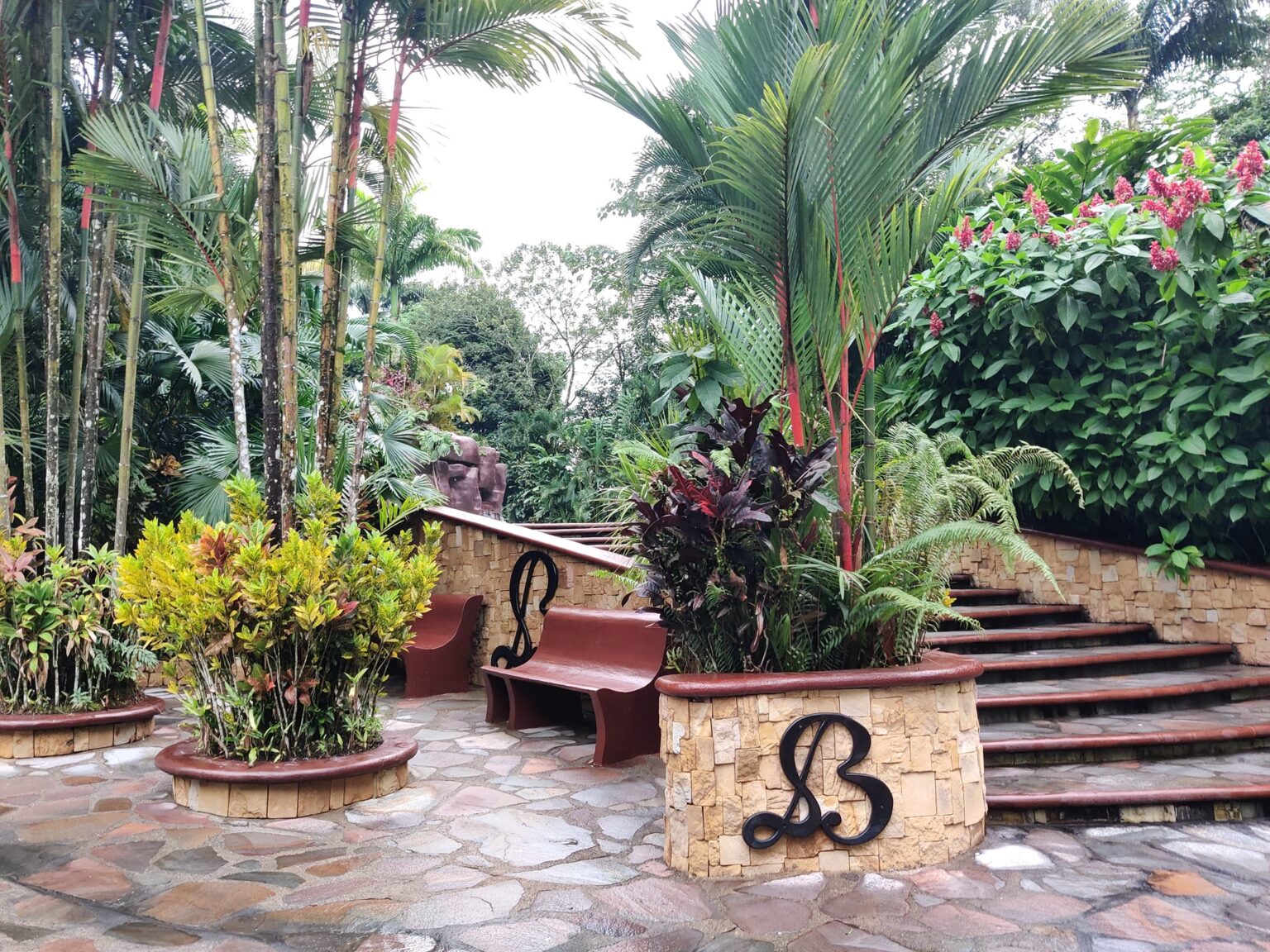 picture of landscaped gardens and letter ''B'' engraved on a flower pot
