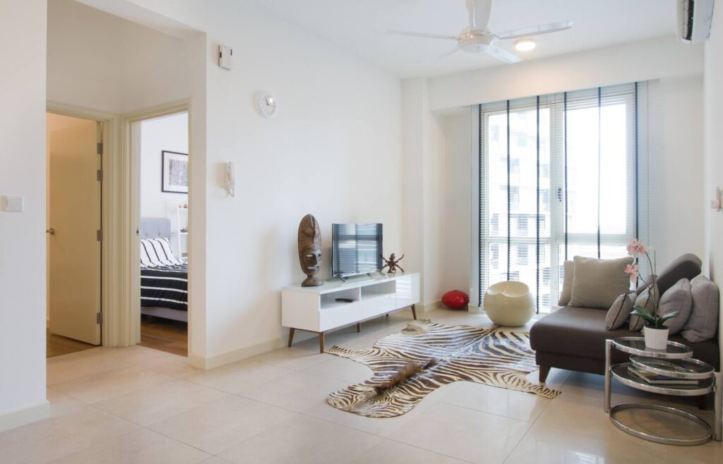 picture of a living room, with a Zebra mat, TV and sofa